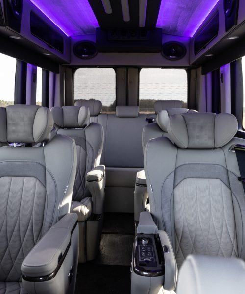 Seating Area with Cool lighting Waldoch Boundary Water Edition Conversion Van 9 Passenger Family Van Best Travel Vehicle